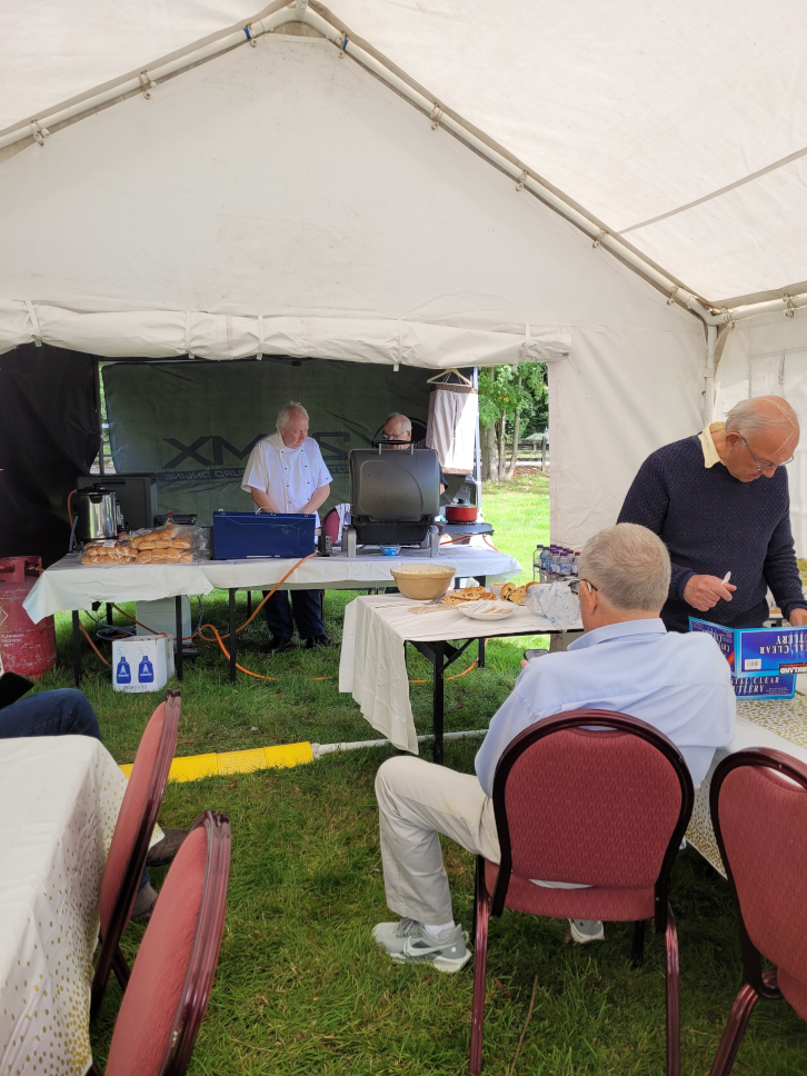 Members of the club prepareing for the club barbecue